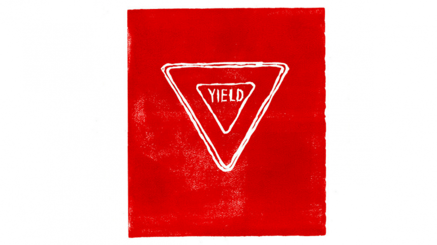 A linocut print with a slightly rough right edge. the ink is fire-engine red with very lightly speckled patches of white paper showing through here and there. in the upper center of the page, the word YIELD in handdrawn letters is tightly enclosed by an upside-down triangle, with is in turn enclosed by another upside down triangle, with a third triangle tight around the second. The borders of the two outer triangles blend together here and there.