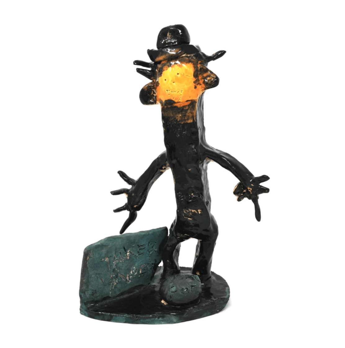 a ceramic figure glazed in black and orange